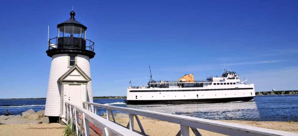 ferry to Nantucket harbor passing by Brant Point Lighthouse