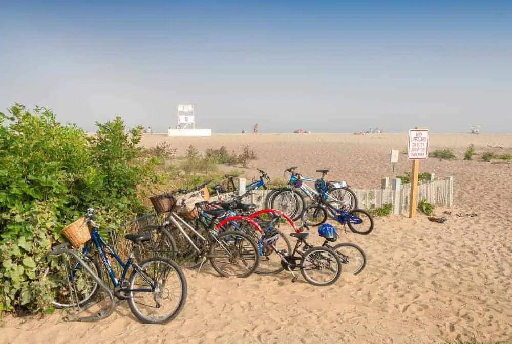 Parked bicycles on the beach in summer. 