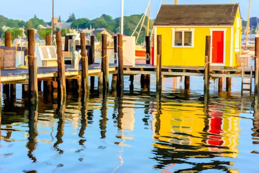 bright yellow shack on water.