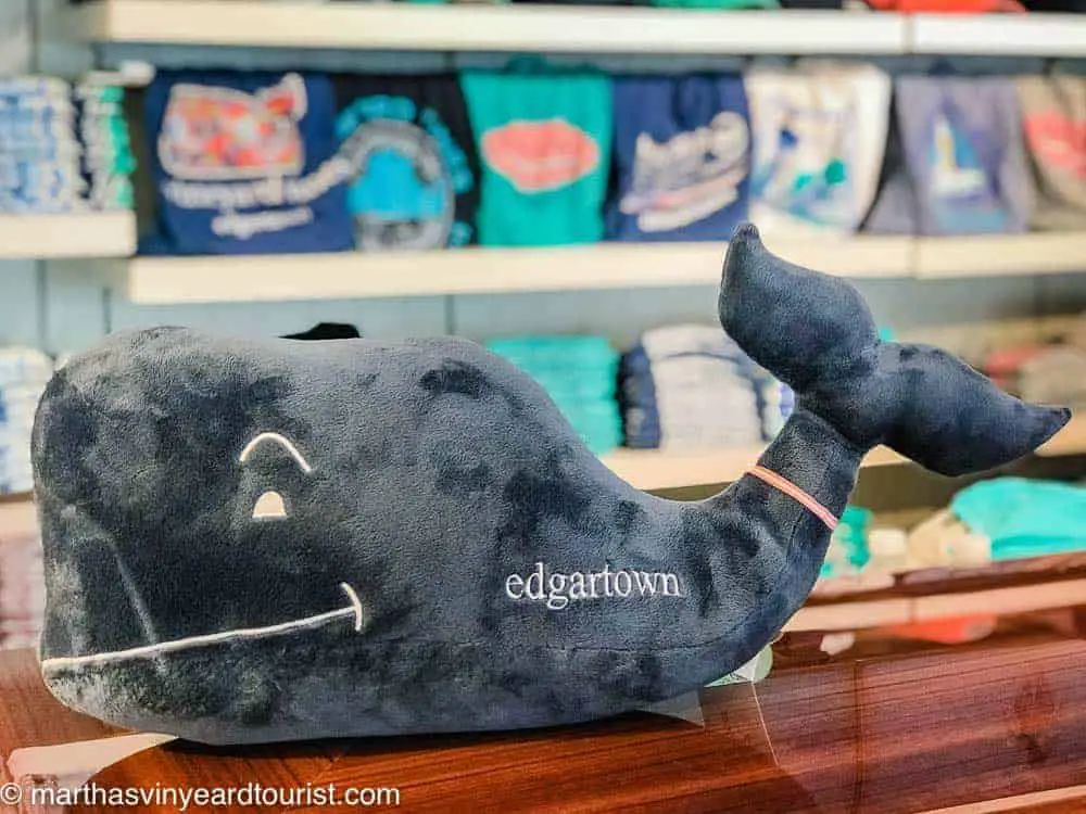 A stuffed whale toy with the words Edgartown in a store