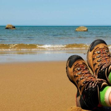 someone sitting with hiking boots at Cape Cod National Seashore