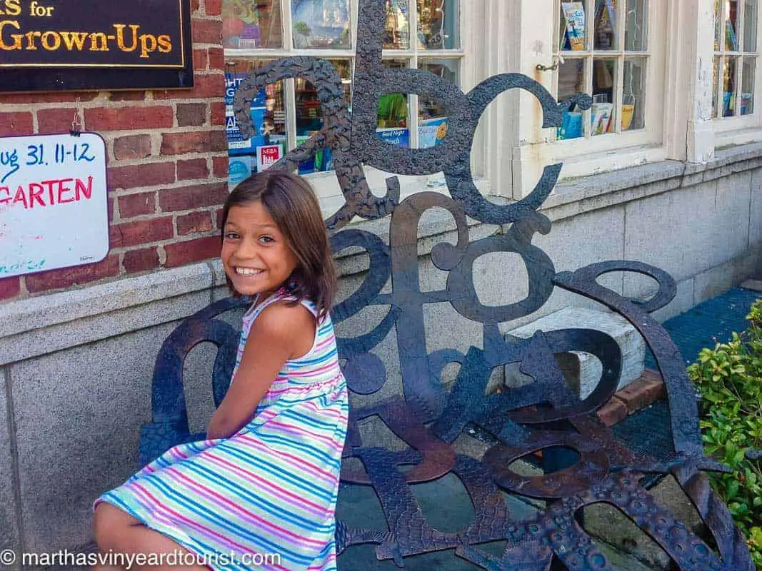 girl on an ABC sculpture bench