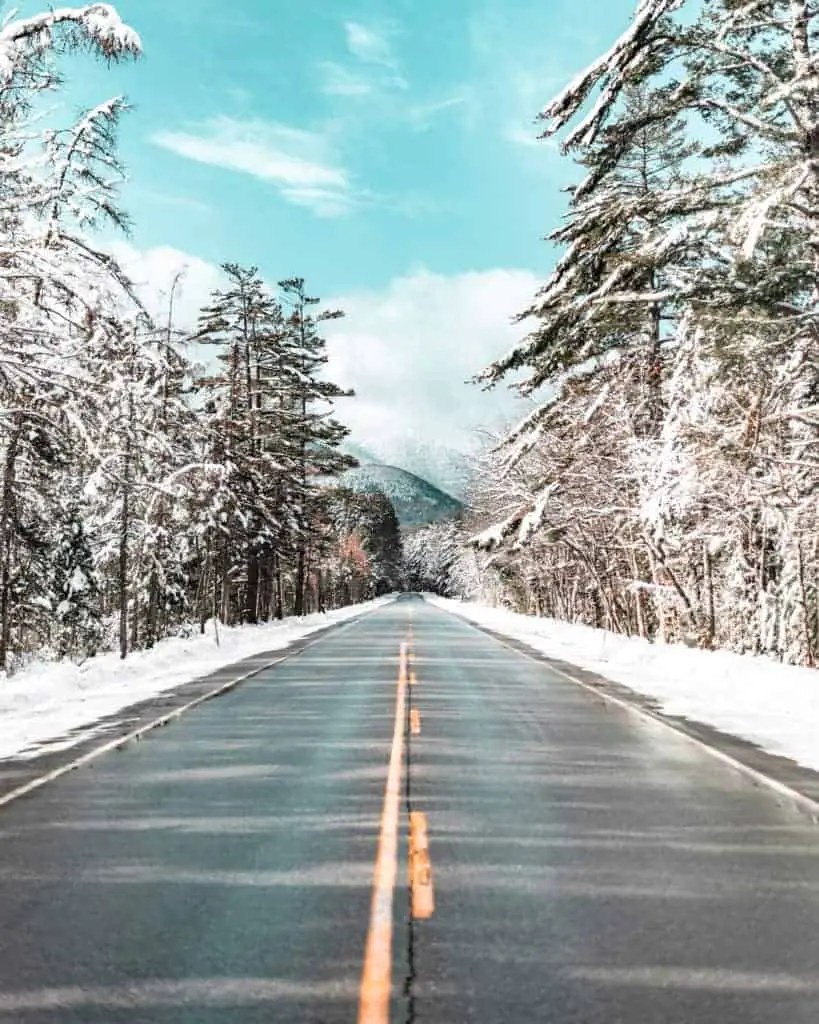 snowy forest and road on Kancamagus Highway