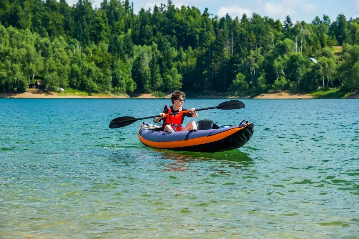 man in inflatable kayak