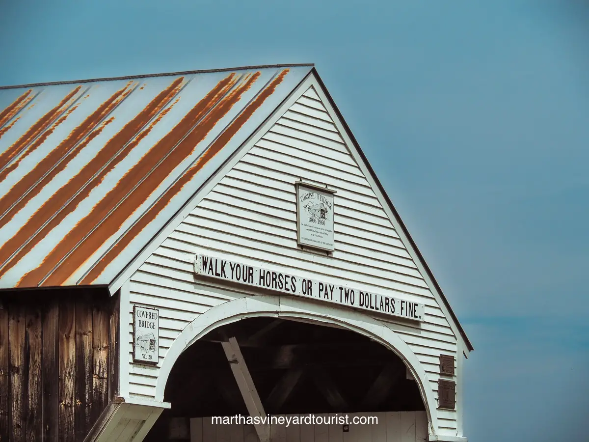 The Cornish-Windsor Covered Bridge with a sign for people to walk their horses
